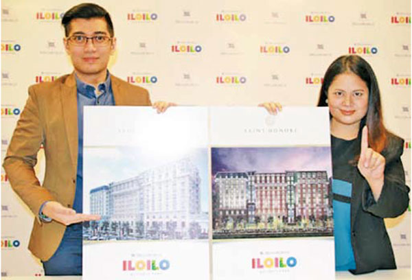 A TASTE OF PARIS Harold C. Geronimo (left), assistant vice president and head of Public Relations and External Affairs, Megaworld and Jennifer Palmares- Fong, vice president for Sales and Marketing – Iloilo Business Park, Megaworld show the renderings of Saint Honore in August 2016. Saint Honore is Megaworld’s 6th residential tower at the 72-hectare Iloilo Business Park in Mandurriao, Iloilo City